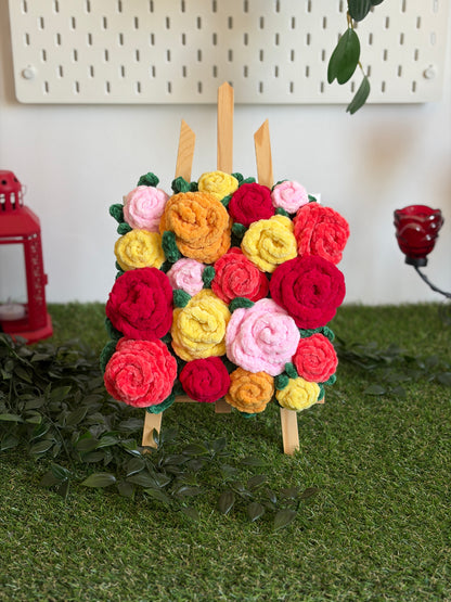 Tableau floral avec bouquet de roses colorées, peinture Nuiba représentant un arrangement élégant de fleurs dans un cadre.